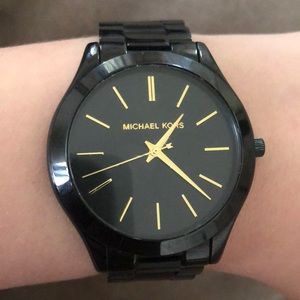 Black Michael Kors slim runway watch